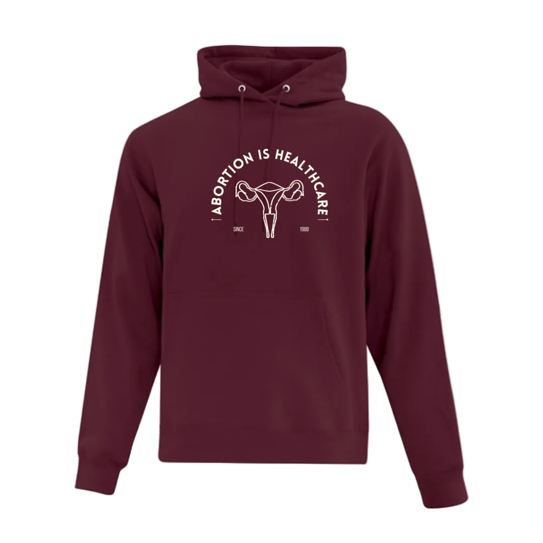 Maroon hoodie with graphic design reading Abortion is Healthcare